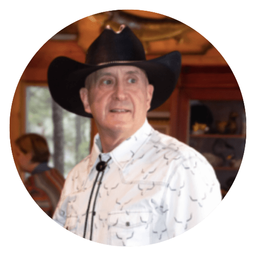 A man in cowboy hat and white shirt.