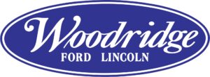 A blue and white logo of woodrow ford lincoln.